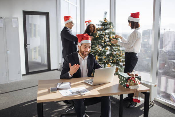 istock Festive man talking on online videocall conference with colleagues. 1819812664
