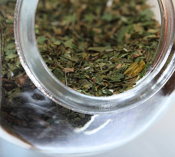 istock Close up jar with lovage spice isolated 181982782