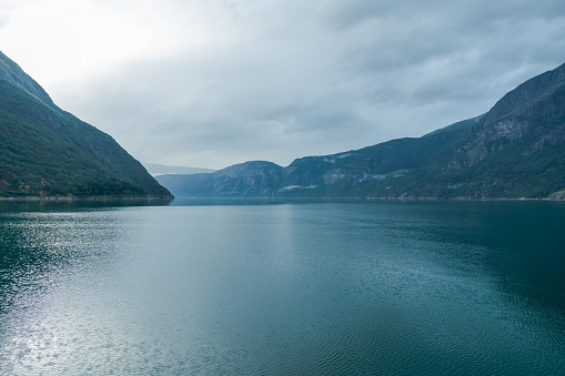 Scenic view of  fjord in Norway on cloudy day in summer