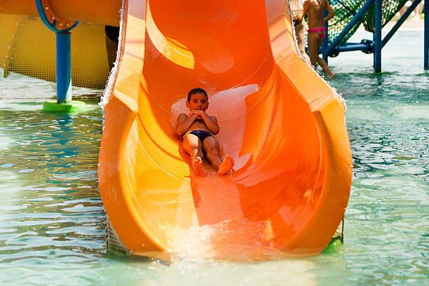 istock Boy having fun on toboggan 181983350
