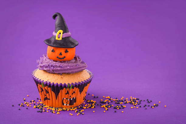 Halloween cupcake Halloween cupcake with pumpkin with witch hat halloween cupcake stock pictures, royalty-free photos & images