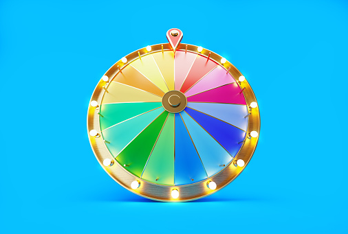 Wheel of fortune on blue background. Horizontal composition with copy space. Front view.