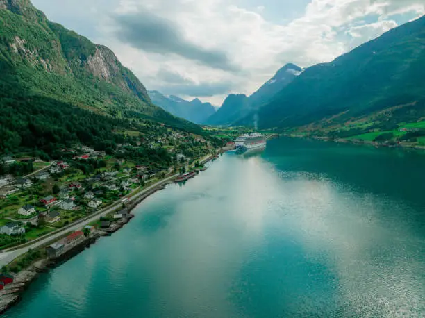 Scenic aerial view of cruise ship in Norwegian fjord in summer