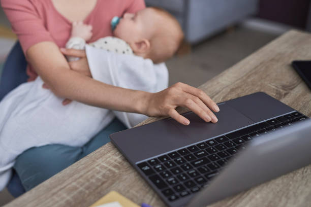 istock Close Up of Unrecognizable Mother Using Laptop 1819850023