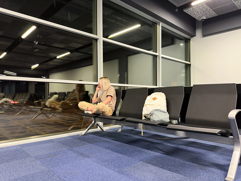 Empty airport terminal waiting area by day - stock photo