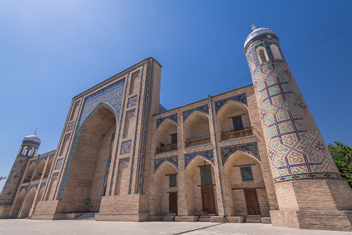 Decorated arches of the Kukeldash Madrasah next to Chorsu bazaar, Tashkent, Uzbekistan. Text translation from Uzbek: Entrance