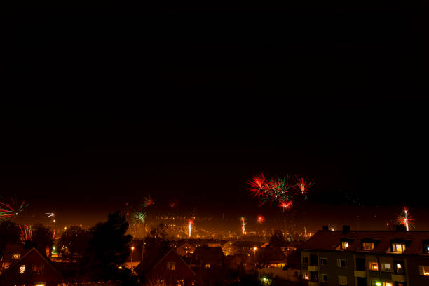 istock Fireworks on a dark sky over city skyline 1819883867