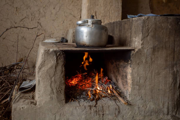 burning wood in stove for boiling water