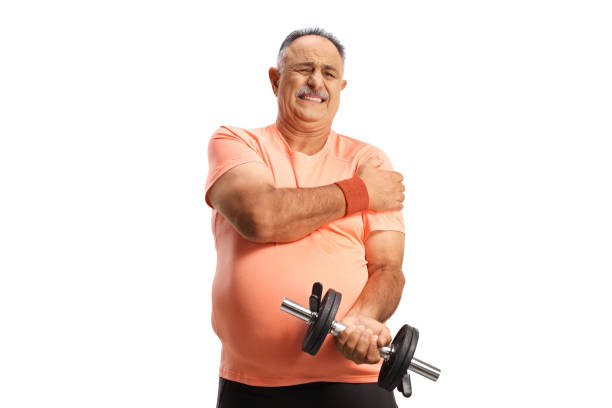 istock Mature man in pain holding a dumbbell 1819901217