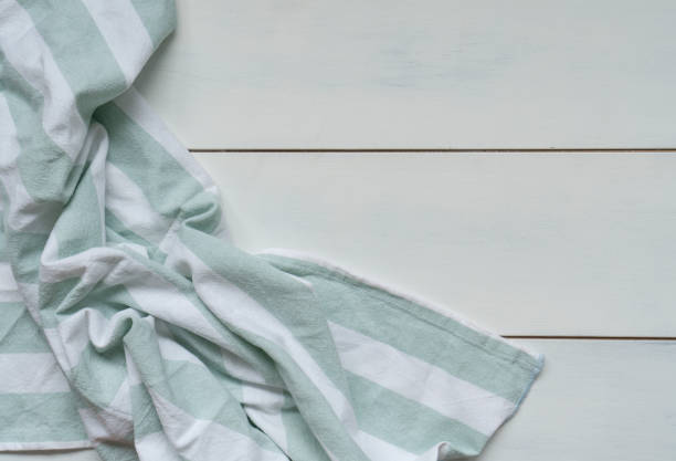istock Green tablecloth on white wooden 1819914477