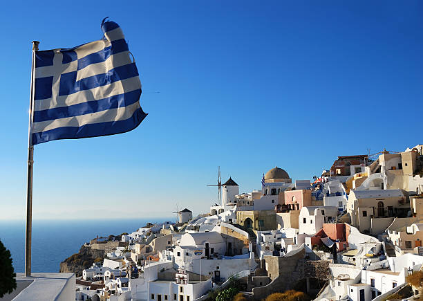 istock Oia scenery with Greece flag, Santorini 181993240