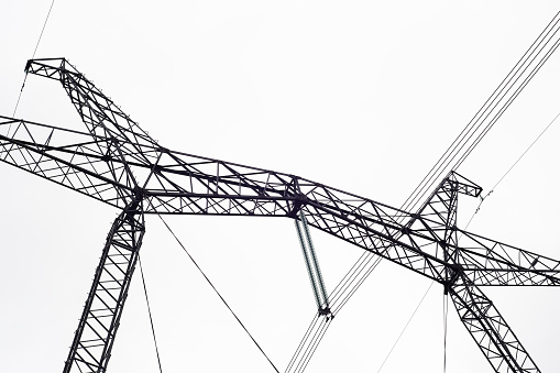 High-voltage transmission line of electrical energy. Metal structure, wires.