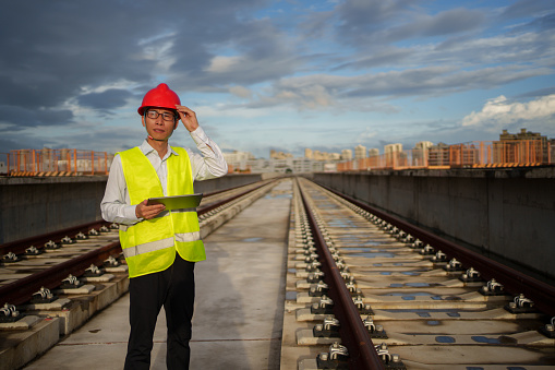 Technical worker inspecting train tracks