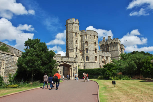 Windsor Castle, Berkshire, United Kingdom, September 20, 2024. Royal residence, palace. View towards Henry VIII gate to the Lower Ward,  just off Castle Hill street. Incidental people. Overcast autumn day outdoors