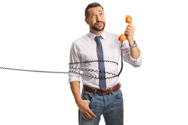 istock Man tied with a rotary phone cable 1819982986