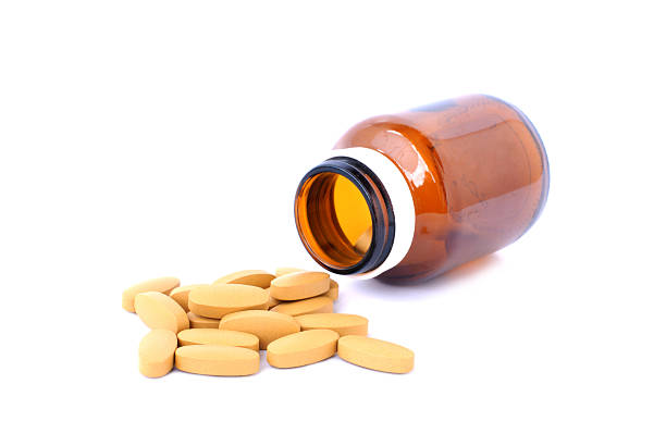 istock Pills spilling out of pill bottle 181998349