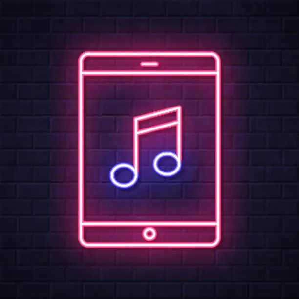 Vector illustration of Music on tablet PC. Glowing neon icon on brick wall background