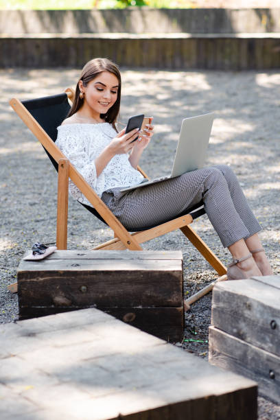 istock Caucasian business young woman working laptop and using mobile smartphone 1820007883