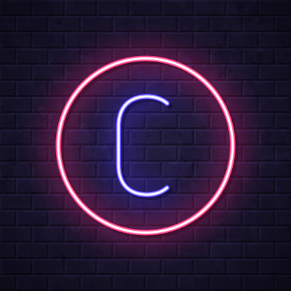 istock Copyright. Glowing neon icon on brick wall background 1820008921