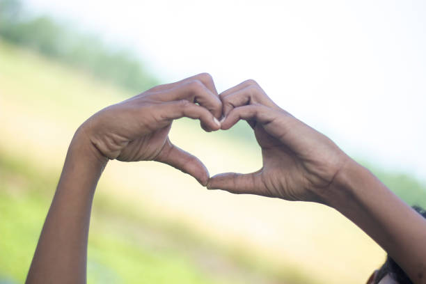 istock A man made a love sign with his hand and blurred background 1820013261