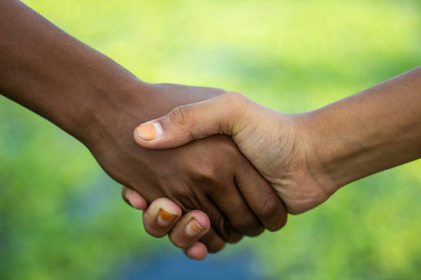 istock A man making handshake with another man and blurred background 1820013770