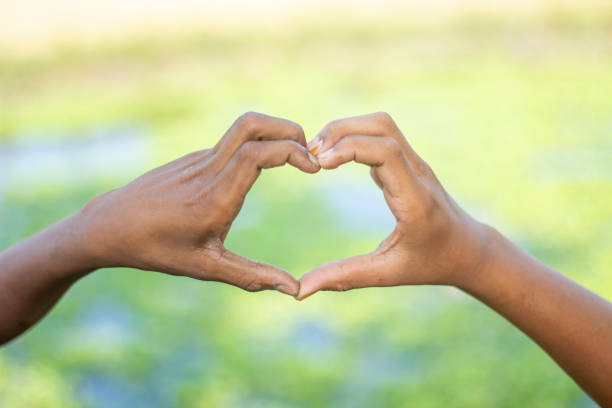 istock A man made a love sign with his hand and blurred background 1820014850