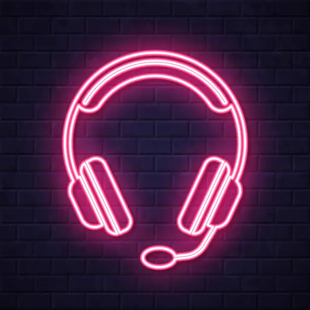 Vector illustration of Headset. Glowing neon icon on brick wall background