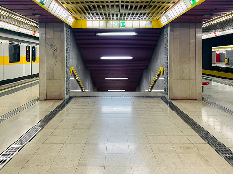 Blurred motion of man against subway train, Germany Hamburg Hafencity Station