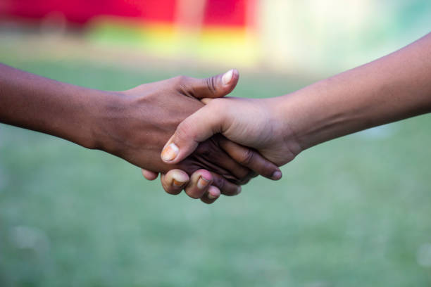 istock A man handshake with another man and blurred background 1820020336