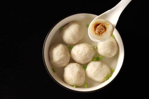 istock soup with dumplings being cooked on the stove top by a white ladle 1820022507