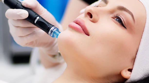 istock Professional dermatologist in medical gloves doing hydro peeling procedure for beautiful woman patient in cosmetology clinic. Close up facial treatment. 1820028512