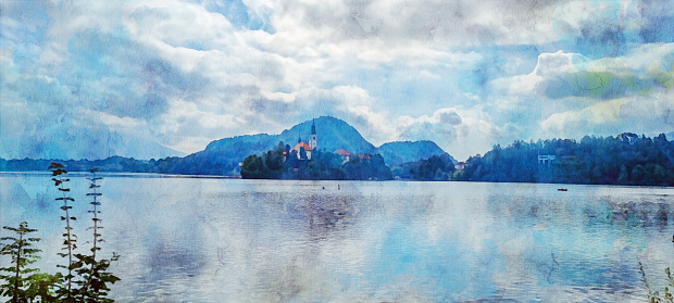 Watercolor effect on a real photo of the Island with a white church on the Lake Bled with a cloudy sky and dark blue mountains in the background. Watercolor effect on a real photo