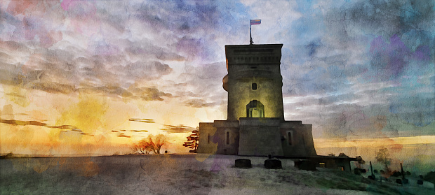 The Monument of Peace and Observation Tower in Cerje (Slovenian Karst plateau) at sunset, an orange and red colored cloudy sky in the background. A bar on the side of the monument, where tourists can drink/eat/rest. Watercolor effect on a real photo.