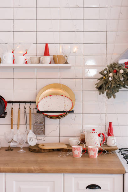 istock Kitchen utensils and Christmas decor in a white cozy kitchen 1820058596