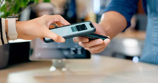 Cashier, customer and phone for POS machine for restaurant fintech, digital payment and easy checkout services. Barista or people hands at point of sale counter with mobile app tap or scan at cafe