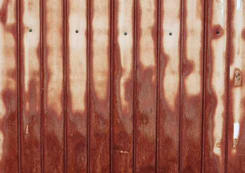 A close-up of a rusted galvanized iron board pasted on a storage shed, photographed on April 16, 2023, Kawagoe City, Saitama Prefecture, Japan.