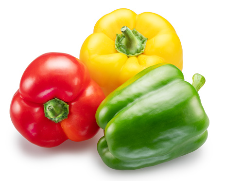 Green, yellow and red sweet peppers on white background. File contains clipping path.