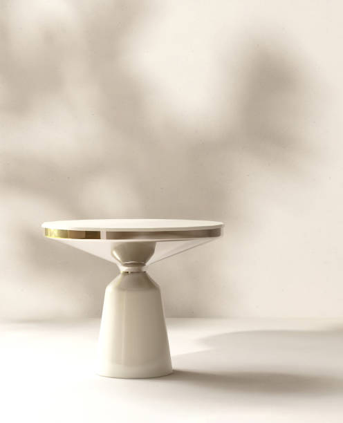 istock Modern white side table podium in sunlight, leaf foliage shadow on beige white room 1820083600