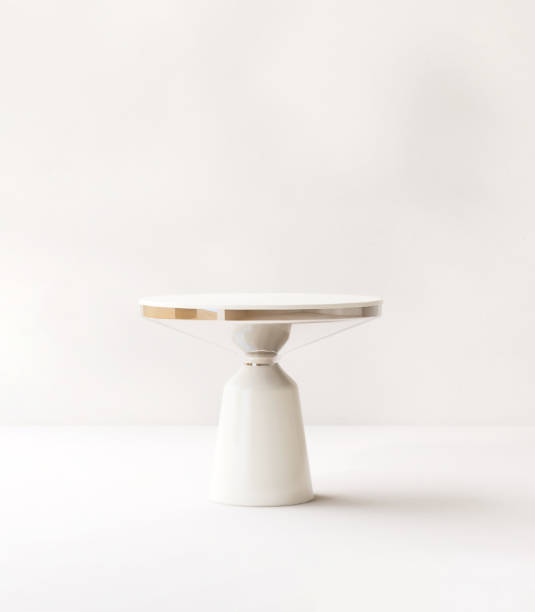 istock Modern white side table podium in sunlight, soft leaf foliage shadow on beige white room background 1820084109