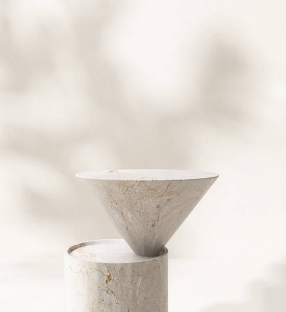 istock Close up modern cone white marble side table podium in sunlight, leaf shadow on beige wall 1820084116