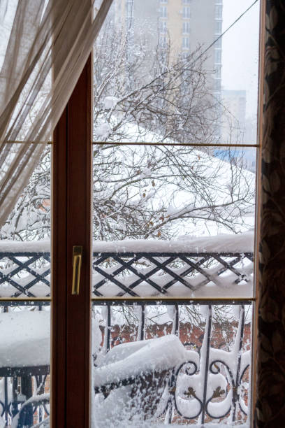 istock Snowy balcony. First snow. Outside the window 1820085198