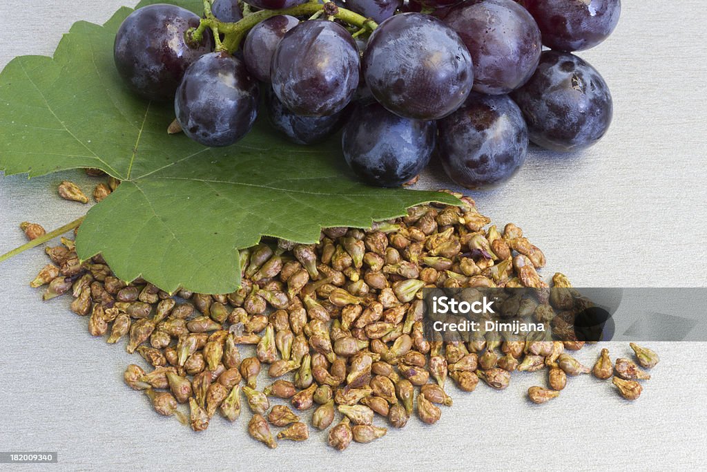 Garpe seed Grapes and grape seeds on the table Grape Stock Photo