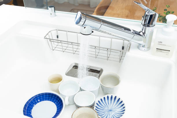 istock Washing dishes accumulated in the sink. 1820097873