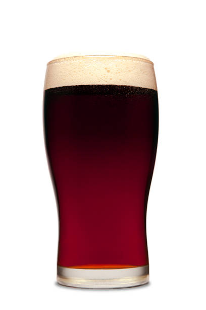 Pint of beer A pint of dark beer isolated on white. amber black photography stock pictures, royalty-free photos & images