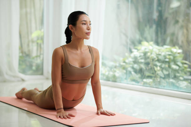 istock Fit Woman Doing Cobra Asana 1820101757