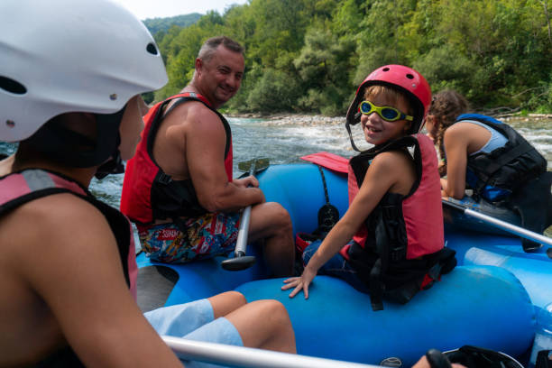 istock A happy family enjoys rafting on the river 1820110516