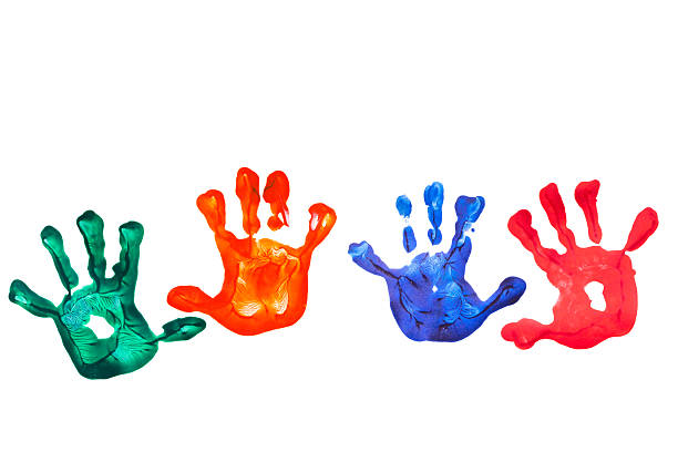 four colored children's hands stock photo
