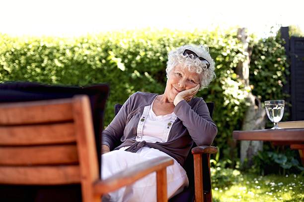 istock Senior woman relaxing in backyard garden 182011588