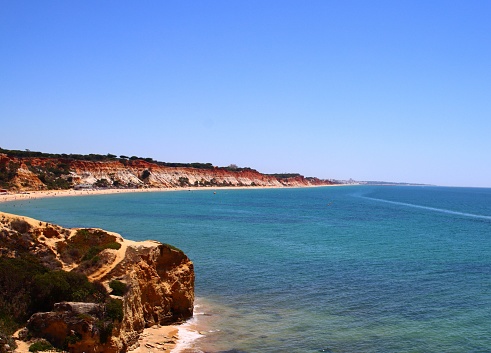 Landscape, shoreline,  rocks, beach, sand rocks, red, ocean, blue, Olhos de Agua,  falesia beach, Algarve, Portugal.