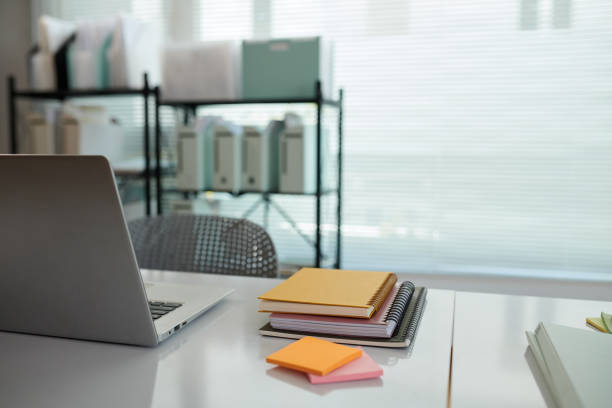 istock Office Desk with Planner and Laptop 1820146441